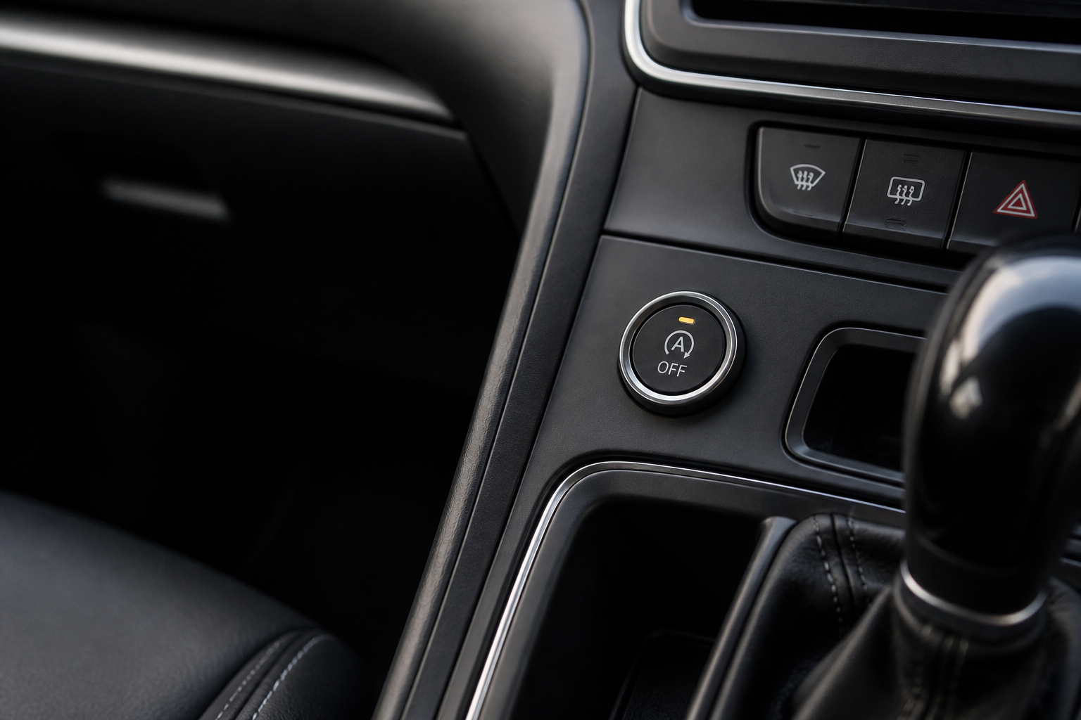 Auto start-stop off control button in a modern vehicle dashboard